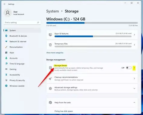 Windows Storage settings showing Storage Sense option with red arrow